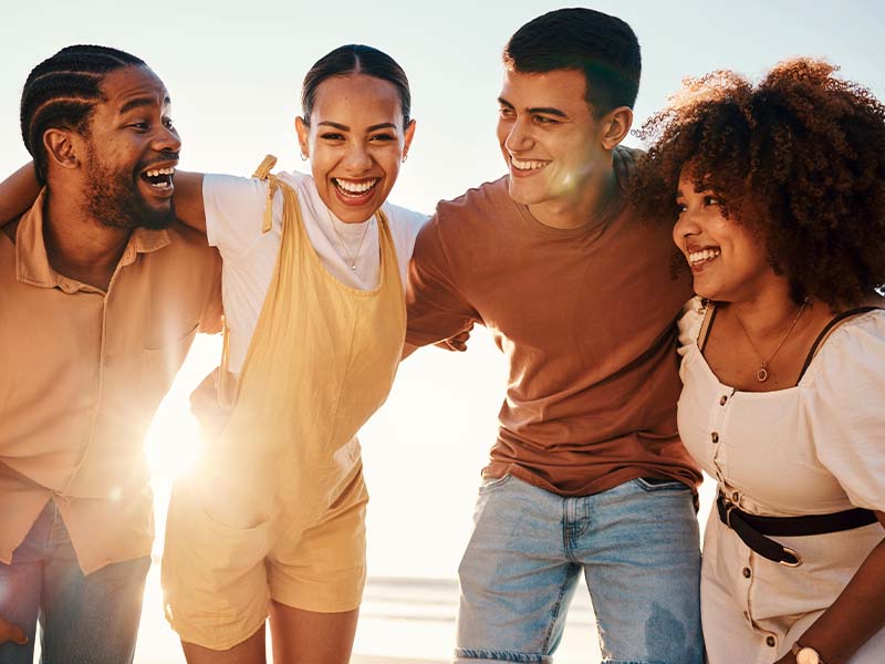 Friends smiling together outdoors