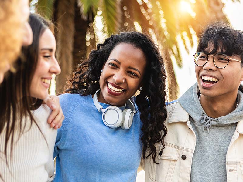 Group of young adults smiling together