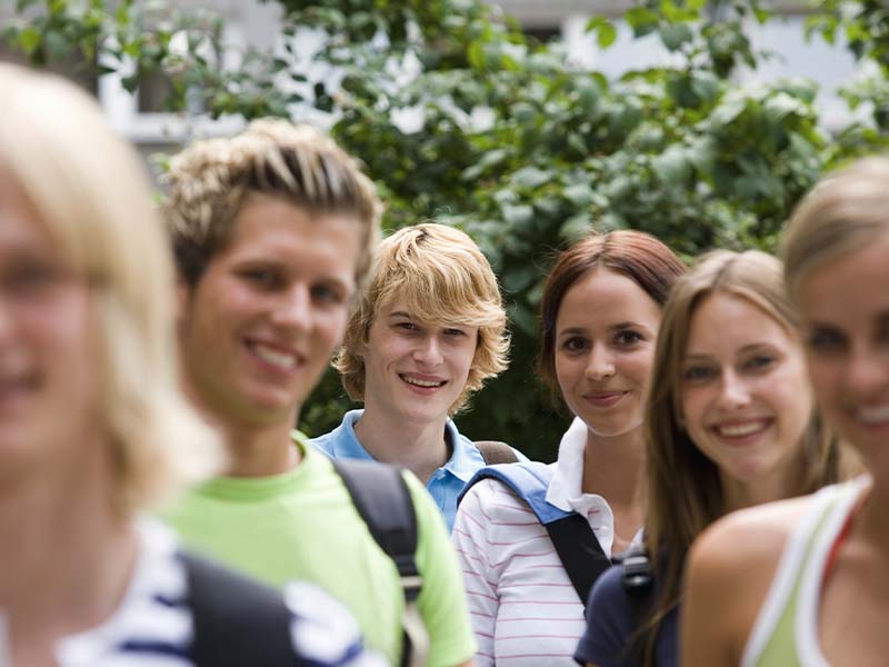 Teenagers smiling together outdoors