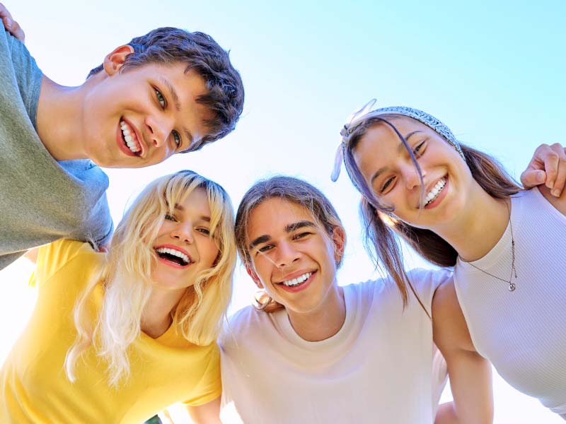 Teen friends smiling together